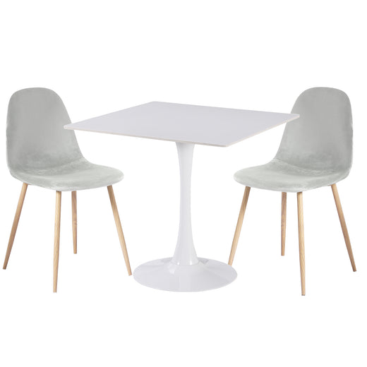 Two gray velvet chairs on a white ceramic coated table on a white background