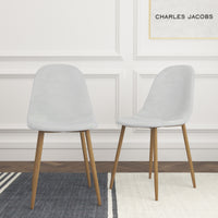 Thumbnail for Two white velvet chairs on a white background