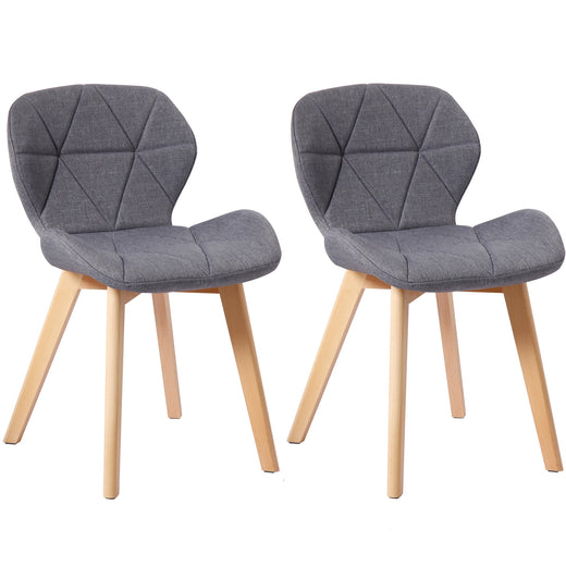 Two dark grey fabric chairs on a white background
