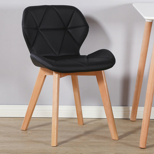 A black fabric chair on a lifestyle background