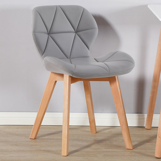 A grey fabric chair on a lifestyle background