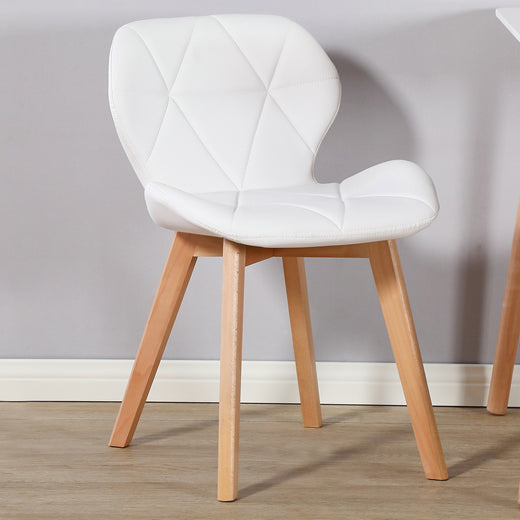 A white fabric chair on a lifestyle background