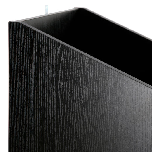 A black oak effect vinyl storage unit, showcasing some items stored inside it, on a white background