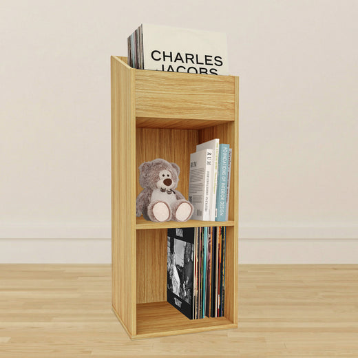 An oak effect vinyl storage unit, showcasing some items stored inside it, on a lifestyle background